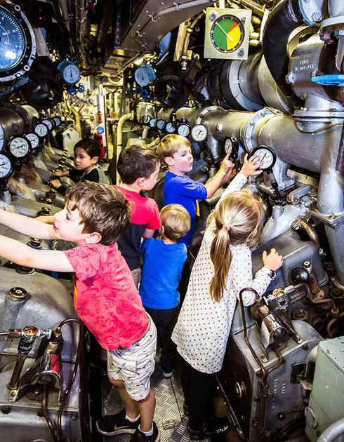 Visitors in the engine room of Submarine Onslow at the Australian National Maritime Museum, Darling Harbour in Sydney.